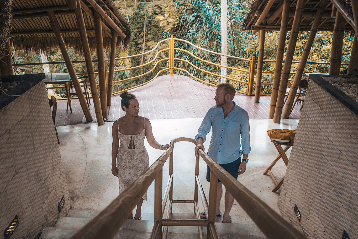 A married couple spends their vacation in a luxury Bali resort, enjoying comfort and happiness. A couple enjoying their Bali holiday at a luxury resort. They look happy and comfortable in the beautiful surroundings.