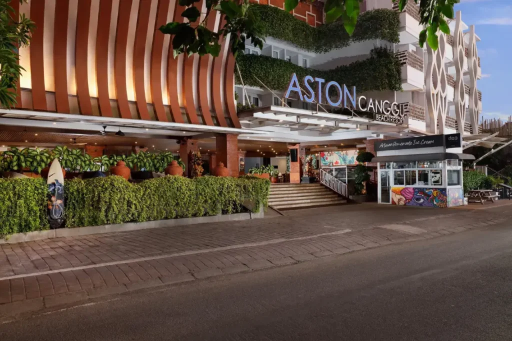 The parking area of Aston Canggu Beach Resort, illustrating the availability of free parking for resort guests. Cars or scooters might be visible.