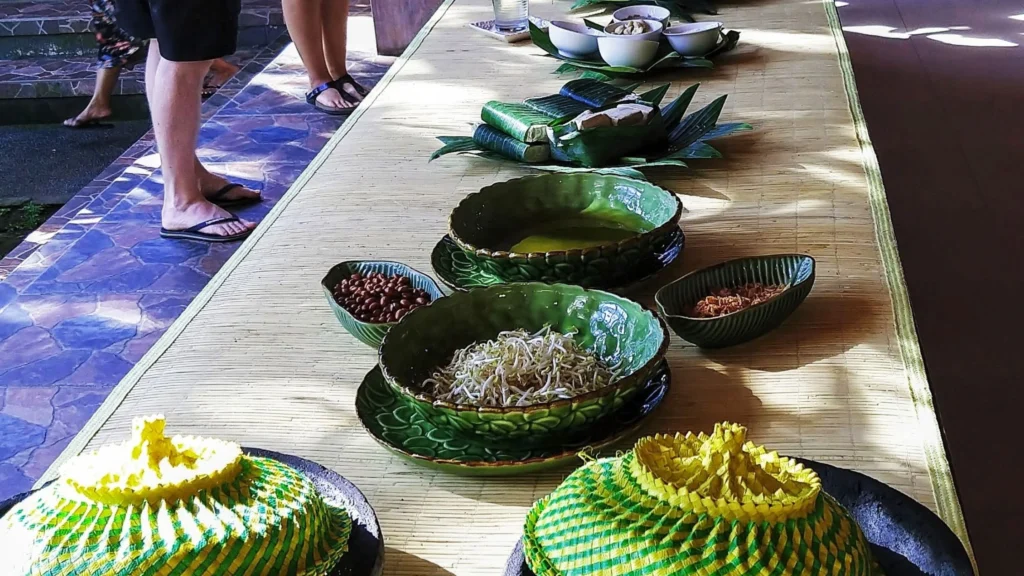Colorful authentic Balinese nasi campur with various traditional side dishes.