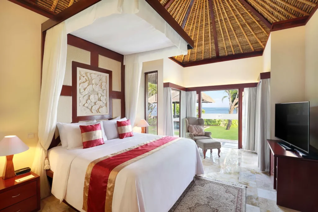 Discovery Kartika Plaza Hotel sits beachfront, showcasing its large swimming pool with ocean views. This popular resort offers practical late check-out solutions for departing guests.
