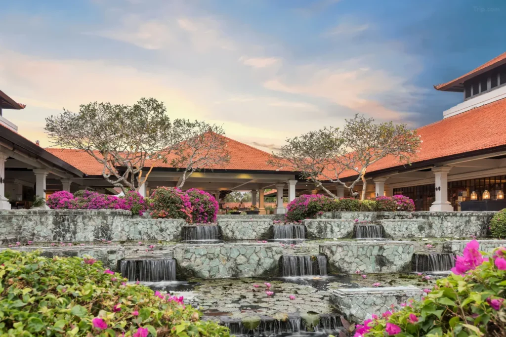 The spacious parking area at the Grand Hyatt Bali in Nusa Dua, indicating free parking for guests. The surroundings suggest a luxury resort.