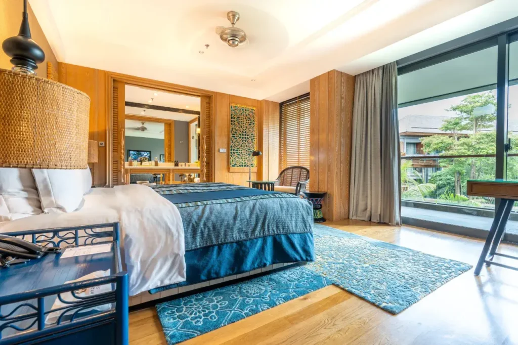 Hotel Indigo Bali Seminyak Beach showcases its vibrant, stylish swimming pool area. This resort is known for its modern design and accommodating late check-out options.