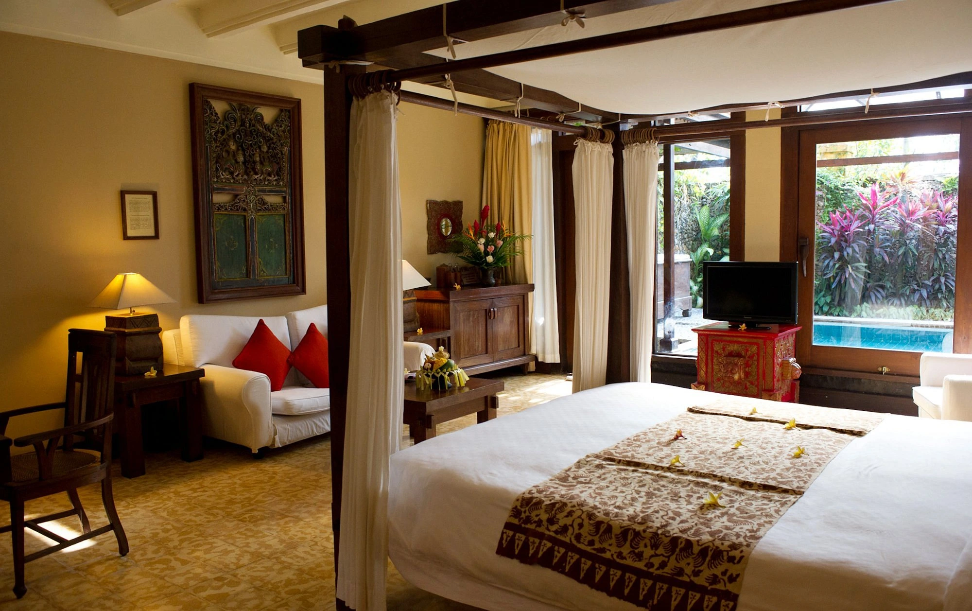 The exterior or a key feature of Hotel Tugu Canggu Bali, highlighting its unique Indonesian architecture, artistic elements, or lush grounds, emphasizing its status as a top smoker-friendly hotel in Bali.