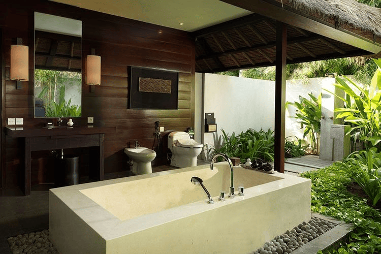 A tranquil scene at Kayumanis Jimbaran Private Estate, showcasing a luxurious villa or its lush tropical gardens, capturing the essence of a private and exclusive retreat in Jimbaran, Bali.