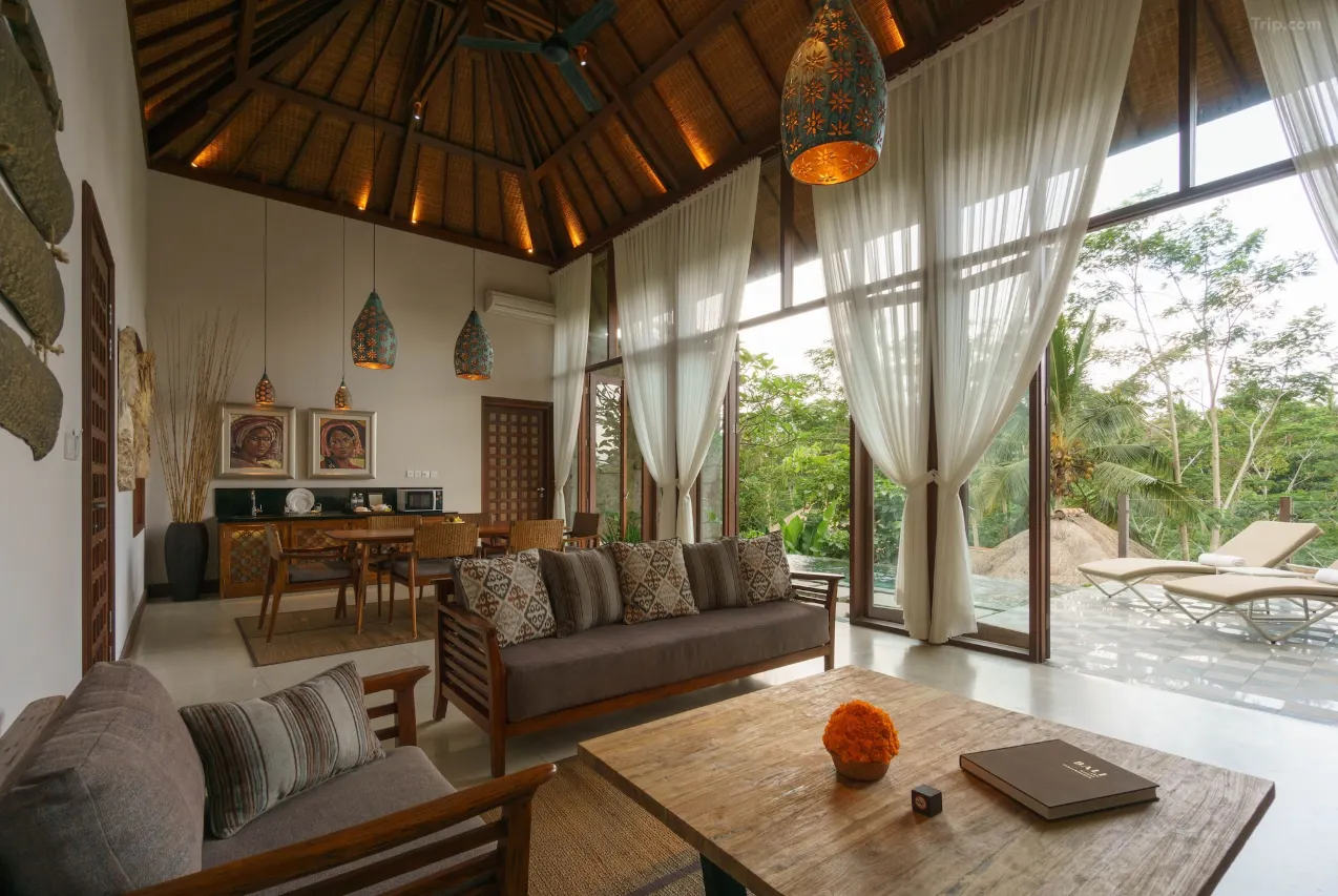 Tejaprana Resort & Spa Ubud villa balcony with serene views of vibrant green rice paddies and tropical gardens.