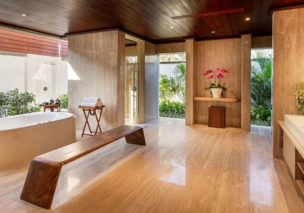 A luxurious villa at The Edge Bali boutique hotel, showcasing elegant design, a private jacuzzi, and stunning ocean views from its cliffside location in Uluwatu, Bali.