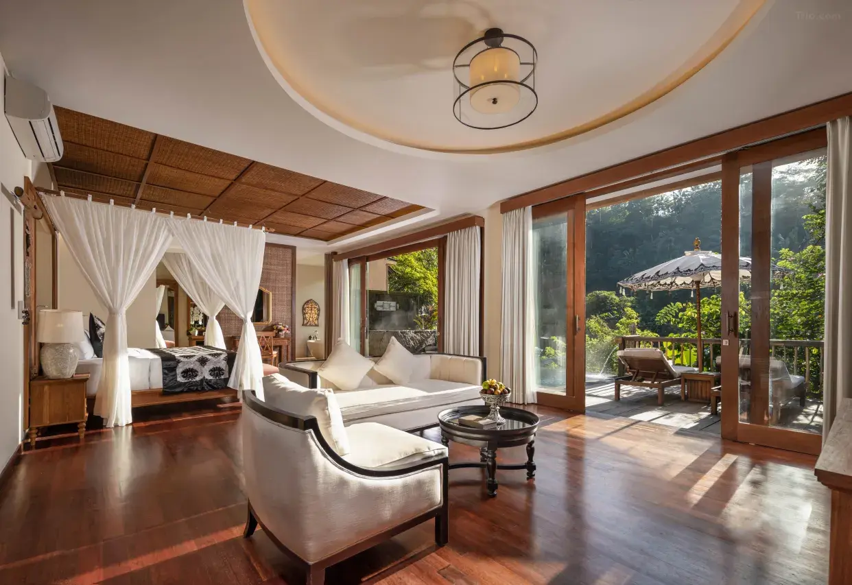 The Kayon Jungle Resort Ubud's iconic multi-tiered infinity pool surrounded by lush rainforest, ideal for honeymoon package deals in Bali.