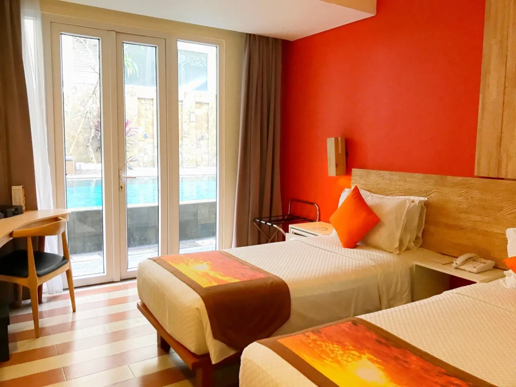 The vibrant exterior or a key feature of The ONE Legian in Kuta, showcasing its appeal as one of Bali's top smoking-friendly hotels.