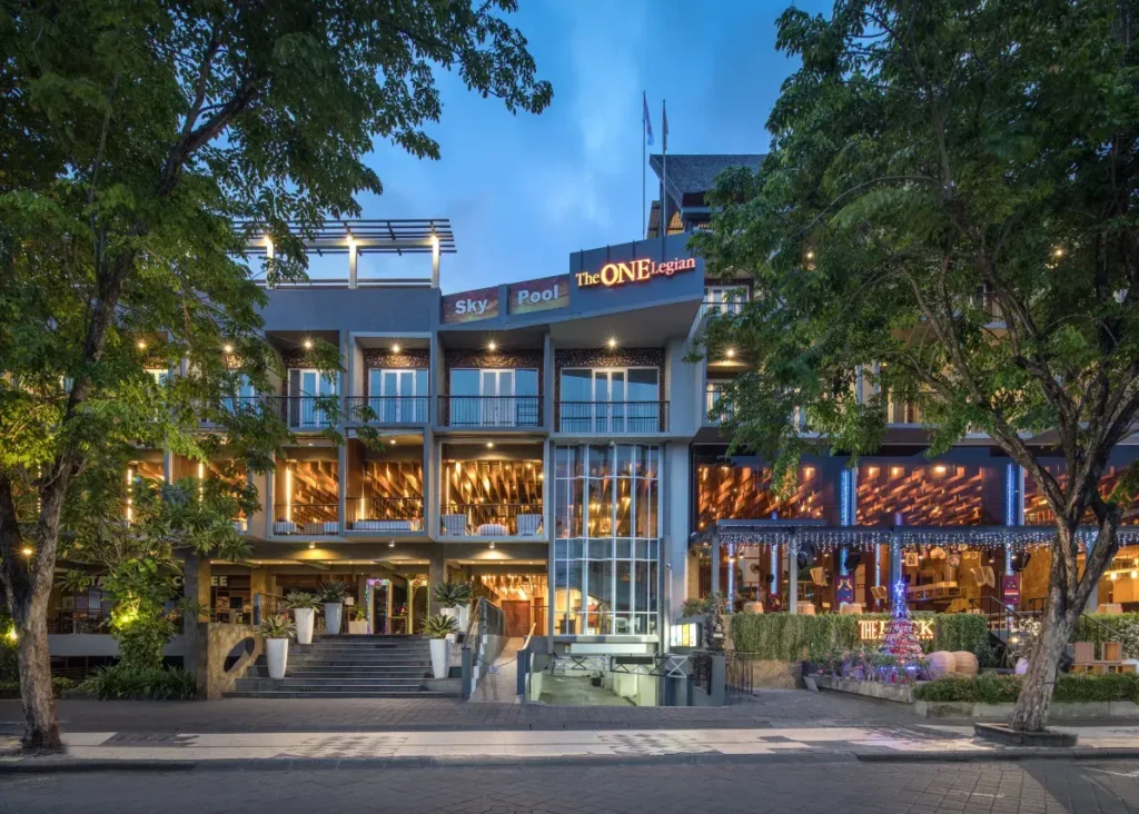 Guests arriving at The ONE Legian in Kuta, highlighting the hotel's free parking area. This shows convenience for visitors with their own transportation.
