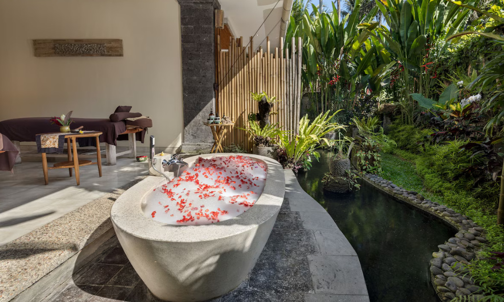 A couple enjoying a quiet, luxurious moment together, possibly on their honeymoon, in a high-end setting luxury jacuzzi in The Sankara Resort – Ubud