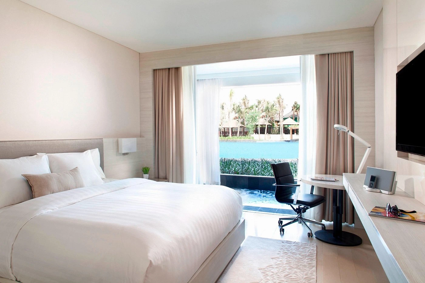 The distinctive facade or a stylish amenity at The Stones Hotel, Legian Beach, illustrating its modern design and reputation as a top smoking-friendly hotel in Bali.