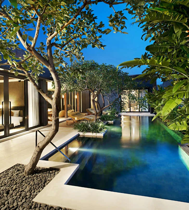 An inviting image showcasing a feature or amenity of a top smoker-friendly hotel in Bali, such as a comfortable outdoor lounge, a balcony with a view, or a designated smoking area, emphasizing its appeal to guests who smoke.