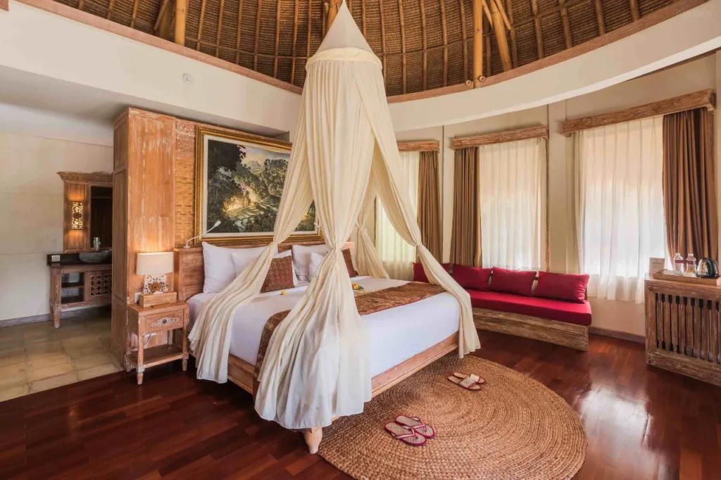 Lush green rice terraces and traditional Balinese architecture at The Udaya Resorts & Spa in Ubud.