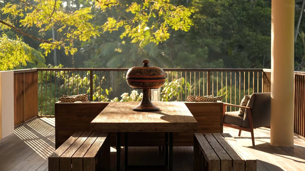 A balcony that’s truly a balco, spacious outdoor seating with ocean view at a beachfront Bali hotel.