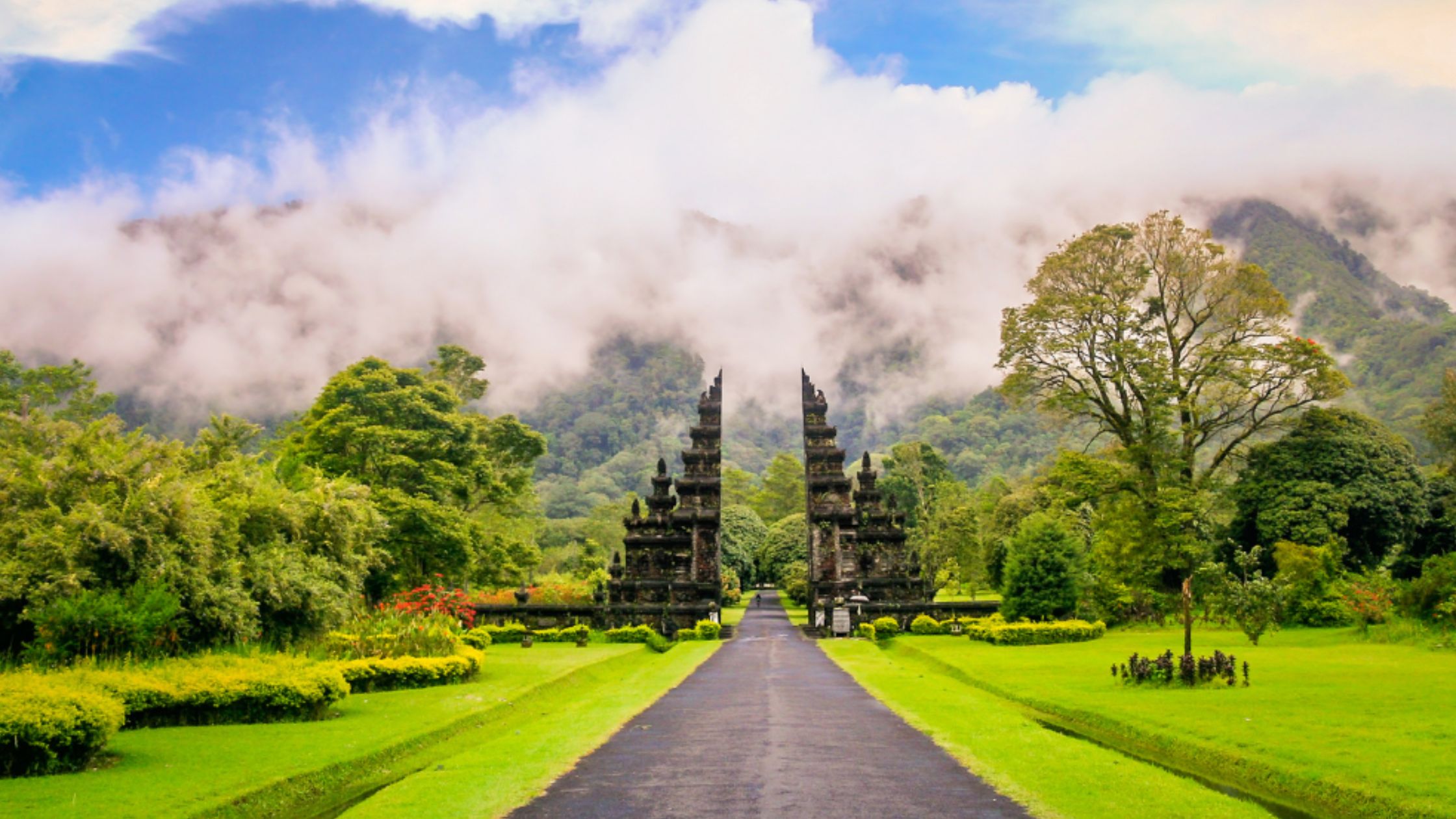 A scenic view of nature with a traditional Balinese gate.