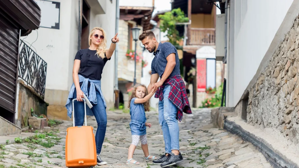 A family planning their budget the importance of calculating costs for a fun and enjoyable family vacation.