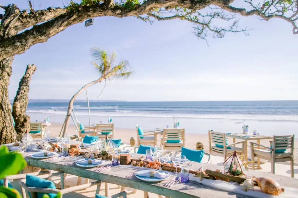Beachfront Bali hotel with pool, private balcony, and free breakfast—tropical escape by the Indian Ocean.