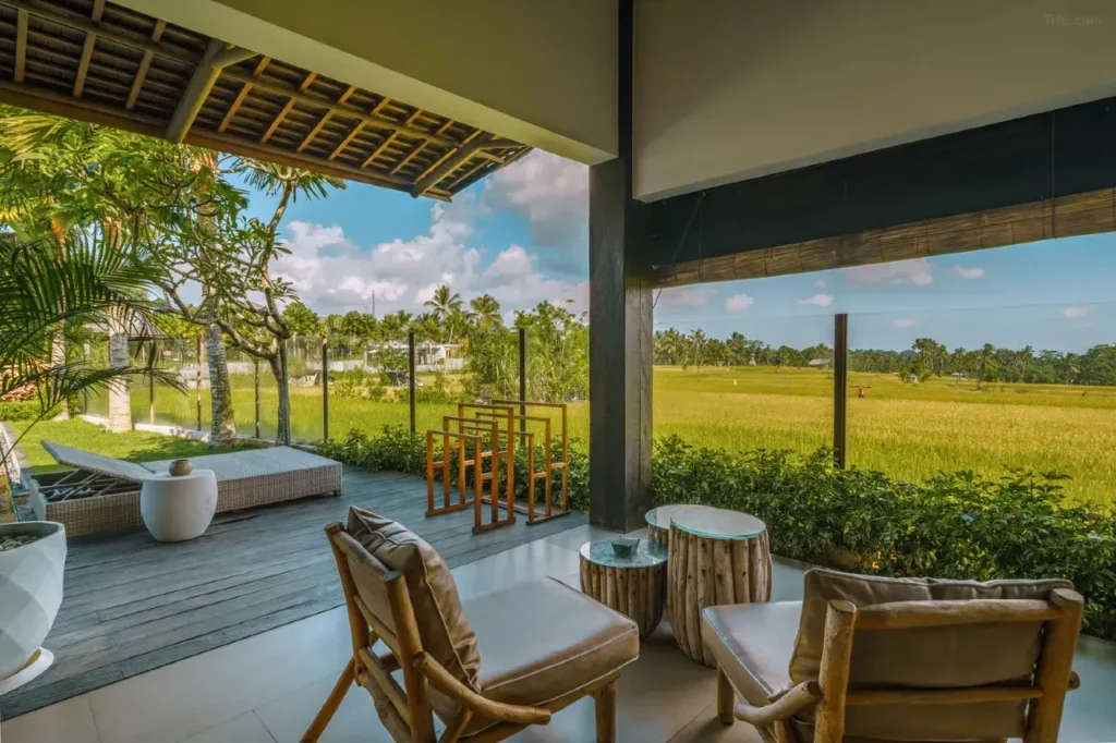 Boutique accommodation in Bali blending modern style with traditional charm and rice field views.