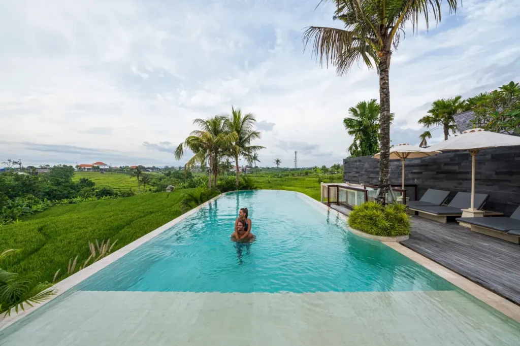 Bali villa offering a unique infinity pool with mountain and rice field views.