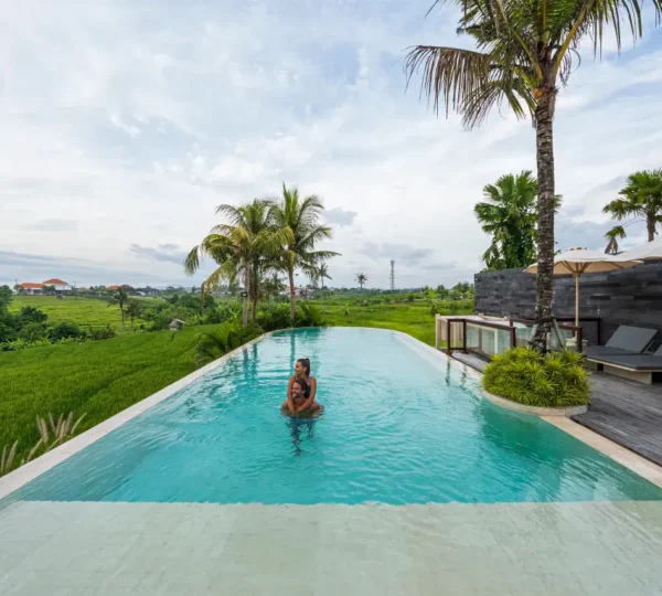 Bali villa offering a unique infinity pool with mountain and rice field views.