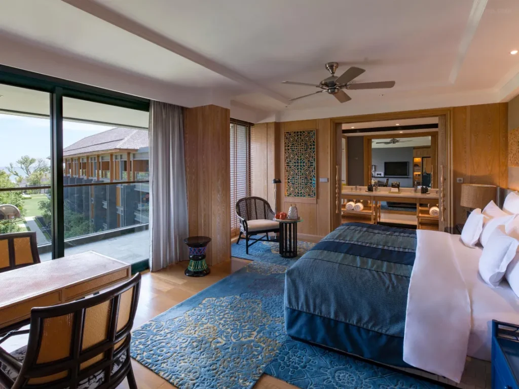 A spacious and luxurious hotel room in Bali, featuring an opulent and classy interior design.