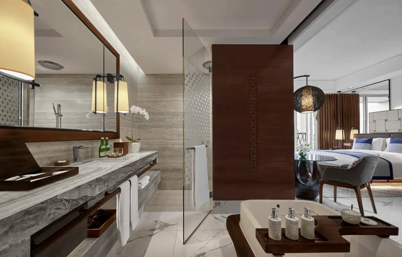 A modern and classy luxury villa with a private pool, featuring a large and extravagant bathroom.