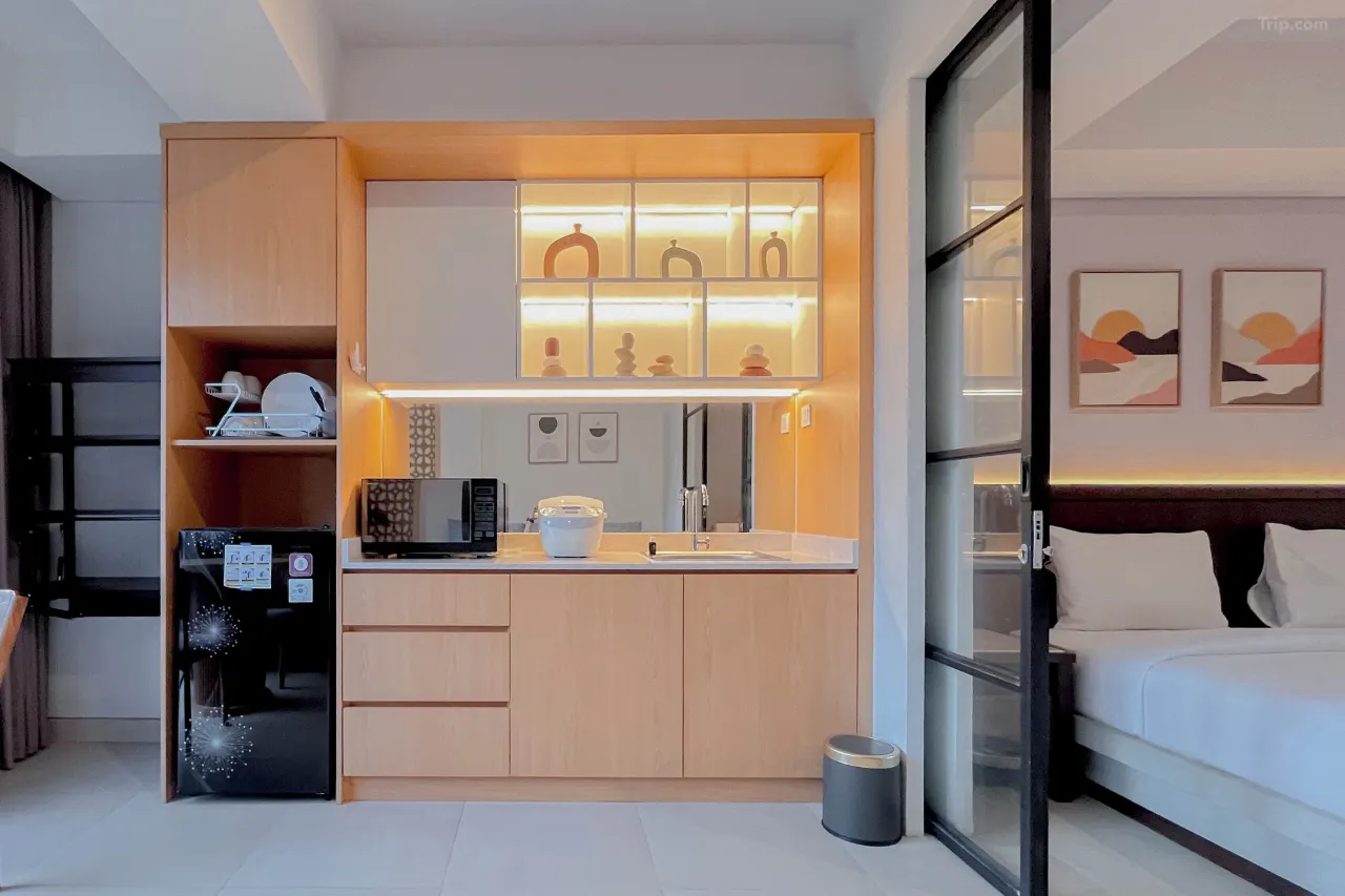 Header Account - Bali Adventours A modern and luxurious hotel kitchen, featuring high-end appliances and a sleek design in Apartment in Lavaya Nusa Dua Bali.