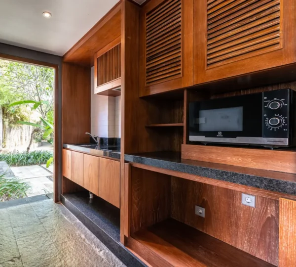 A modern and luxurious hotel kitchen, featuring high-end appliances and a sleek design.