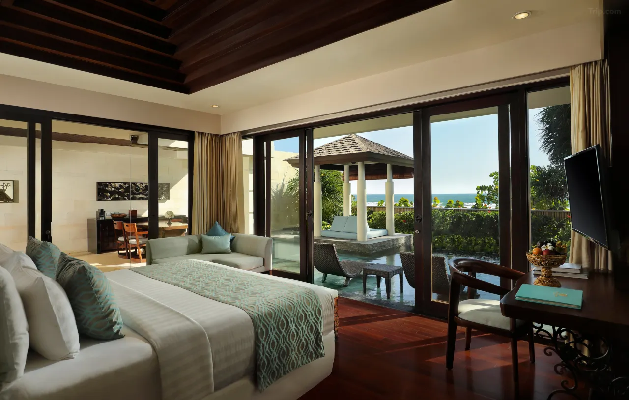 The Seminyak Beach Resort & Spa, a luxury hotel with a pool overlooking the ocean.