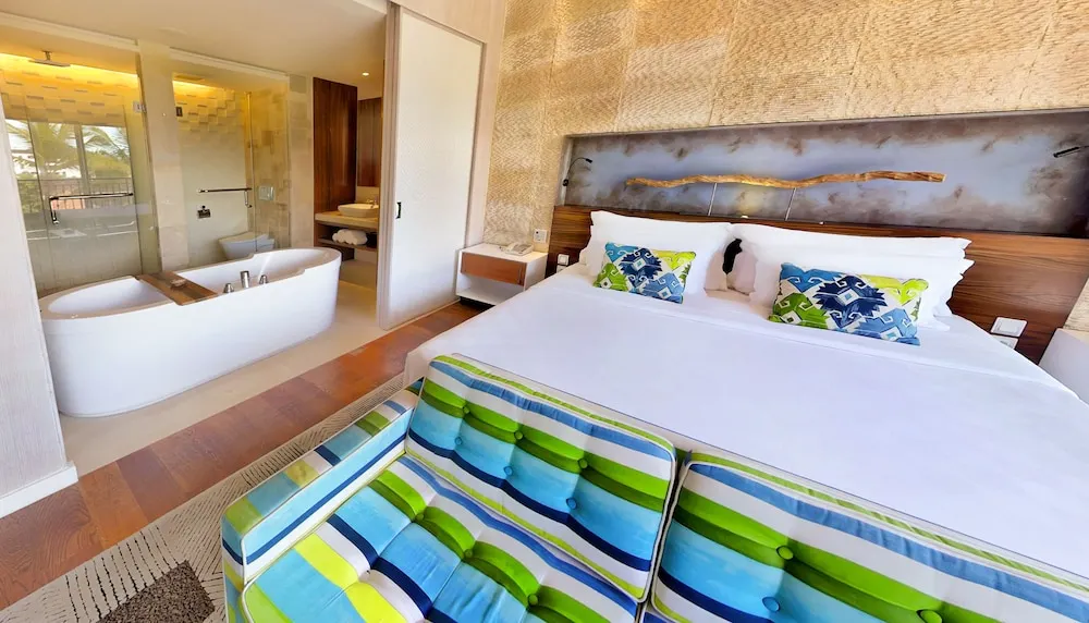 Rooftop pool and bar area at TS Suites Seminyak, perfect for sunset drinks in Bali.
