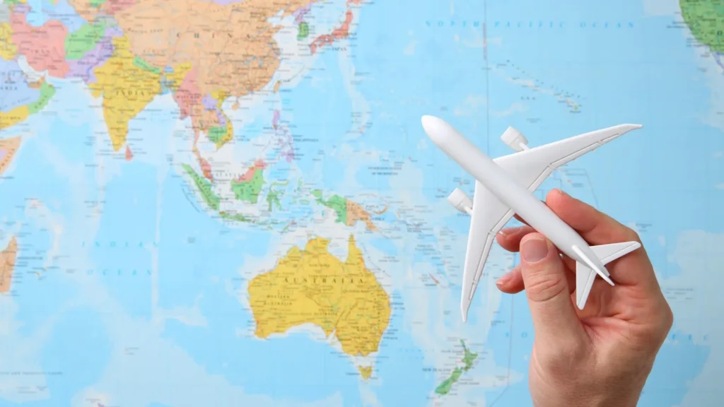 Traveler checking Bali flight tickets and booking activities before flying to the island.