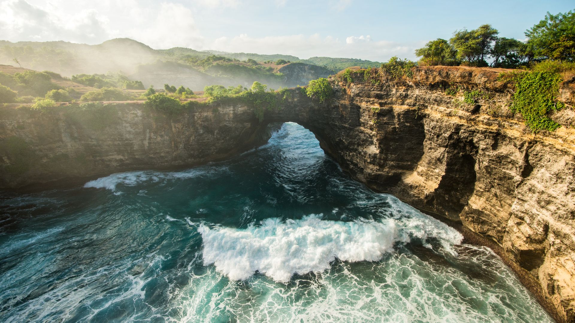 A unique Bali beach with natural landscapes and blue water. The view looks quiet and beautiful, away from crowds.