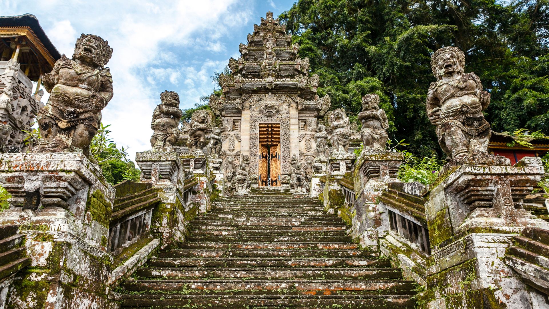 Kehen Temple in Bali during a cultural tour. The ancient stone gates and peaceful setting highlight its spiritual charm.